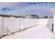 Small patio area with white metal table and chairs, next to a white fence at 5912 32Nd N Ave, St Petersburg, FL 33710