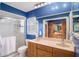 Bathroom with double vanity, shower, and a separate tub at 6004 1St W Ave, Bradenton, FL 34209