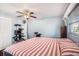 Spacious bedroom with a king-size bed and cat tree at 6004 1St W Ave, Bradenton, FL 34209