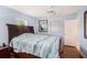 Bright bedroom with wood flooring, ceiling fan, and large bed at 6004 1St W Ave, Bradenton, FL 34209