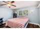 Bedroom with a large bed and coastal-themed bedding at 6004 1St W Ave, Bradenton, FL 34209