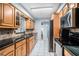 Modern kitchen with stainless steel appliances and ample wood cabinets at 6004 1St W Ave, Bradenton, FL 34209