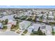 Aerial view of waterfront homes with colorful exteriors and private docks at 6408 Key Island Ave, Apollo Beach, FL 33572