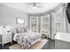 Charming bedroom with a bed, nightstand and window seating at 6408 Key Island Ave, Apollo Beach, FL 33572