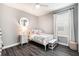 Well-lit bedroom with a bed, nightstand and ample closet space at 6408 Key Island Ave, Apollo Beach, FL 33572
