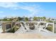 Waterfront deck with fire pit and seating area at 6408 Key Island Ave, Apollo Beach, FL 33572