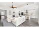 Open concept living area with kitchen and pool access at 6408 Key Island Ave, Apollo Beach, FL 33572
