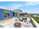 Outdoor patio with fire pit and waterfront views at 6408 Key Island Ave, Apollo Beach, FL 33572