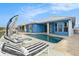 Relaxing pool area with lounge chairs and umbrella at 6408 Key Island Ave, Apollo Beach, FL 33572