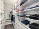 Spacious walk-in closet with ample shelving and hanging space at 6408 Key Island Ave, Apollo Beach, FL 33572