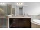 Bathroom with double sinks and soaking tub at 6429 Seasound Dr, Apollo Beach, FL 33572