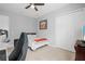 Bright bedroom featuring a bed, closet, and workspace at 6429 Seasound Dr, Apollo Beach, FL 33572
