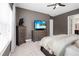 Bright bedroom with window coverings and a dresser at 6429 Seasound Dr, Apollo Beach, FL 33572