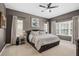 Bright bedroom with plush bed, neutral walls and window coverings at 6429 Seasound Dr, Apollo Beach, FL 33572