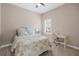 Cozy bedroom with a floral bedspread and a desk at 6429 Seasound Dr, Apollo Beach, FL 33572