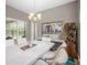 Modern dining room with a marble-top table and stylish chandelier at 6429 Seasound Dr, Apollo Beach, FL 33572