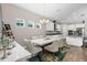 Bright dining room with a large table, chandelier, and wine rack at 6429 Seasound Dr, Apollo Beach, FL 33572