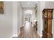 Grand hallway with tile flooring and views to the pool and living area at 6429 Seasound Dr, Apollo Beach, FL 33572