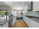 Modern kitchen with large island and hardwood floors at 6429 Seasound Dr, Apollo Beach, FL 33572