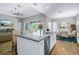 Spacious kitchen with island, stainless steel appliances, and gray countertops at 6429 Seasound Dr, Apollo Beach, FL 33572