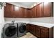 Laundry room with washer, dryer, and ample cabinetry at 6429 Seasound Dr, Apollo Beach, FL 33572