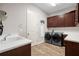 Laundry room with washer, dryer, and ample cabinetry at 6429 Seasound Dr, Apollo Beach, FL 33572