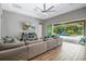 Spacious living room with pool view and comfy seating at 6429 Seasound Dr, Apollo Beach, FL 33572