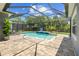 Screened pool and patio with lounge chairs; perfect for relaxation at 6429 Seasound Dr, Apollo Beach, FL 33572