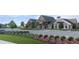 Community clubhouse with landscaping and parking at 6690 Michael Favor Way, Wesley Chapel, FL 33545