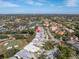 Aerial view of home near golf course and lake at 7710 Palm Aire Ln, Sarasota, FL 34243