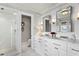 Elegant bathroom with double vanity, marble countertops, and glass shower at 836 S Bayside Dr, Tampa, FL 33609