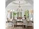 Formal dining room with a large wooden table and ornate chandelier at 836 S Bayside Dr, Tampa, FL 33609