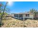 View of home's back and screened porch at 9836 Rainbow Ln, Port Richey, FL 34668