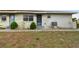 Front view of the house showcasing landscaping and parking at 1025 Apollo Beach Blvd # D, Apollo Beach, FL 33572