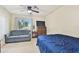 Cozy bedroom with a double bed and a sofa for extra seating at 10265 Gandy N Blvd # 1715, St Petersburg, FL 33702
