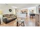Open concept living room with wood-look floors and kitchen views at 10265 Gandy N Blvd # 1715, St Petersburg, FL 33702