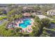 Community pool with patio furniture and hot tub at 10265 Gandy N Blvd # 1715, St Petersburg, FL 33702