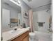 Main bathroom with tub shower, single vanity, and good storage at 10817 Keys Gate Dr, Riverview, FL 33579