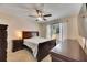 Primary bedroom with a large bed and dresser at 10817 Keys Gate Dr, Riverview, FL 33579