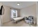 Bedroom with window, chair, and small bed at 10817 Keys Gate Dr, Riverview, FL 33579