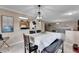 Dining room with a chandelier, table and chairs, and a view into the living room at 10817 Keys Gate Dr, Riverview, FL 33579