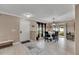 Open concept dining room with a chandelier, table and chairs, and access to the patio at 10817 Keys Gate Dr, Riverview, FL 33579
