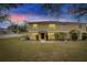 Two-story townhome with a landscaped lawn and a covered patio at 10817 Keys Gate Dr, Riverview, FL 33579