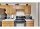 Clean and functional kitchen with wood cabinets and modern appliances at 10817 Keys Gate Dr, Riverview, FL 33579