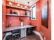 Modern co-working space with a vibrant coral wall at 10860 Ibis Brook Ct, Land O Lakes, FL 34638