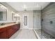 Spa-like bathroom with double vanity and a large walk-in shower at 11911 Mandevilla Ct, Tampa, FL 33626