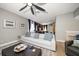Versatile bonus room with comfortable seating and a ceiling fan at 11911 Mandevilla Ct, Tampa, FL 33626