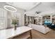 Bright dining area with marble top table and view into the living room at 11911 Mandevilla Ct, Tampa, FL 33626