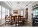 Formal dining room with hardwood floors, large table, and wine fridge at 11911 Mandevilla Ct, Tampa, FL 33626