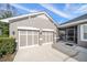 Two-car garage with extra space and screened enclosure at 11911 Mandevilla Ct, Tampa, FL 33626
